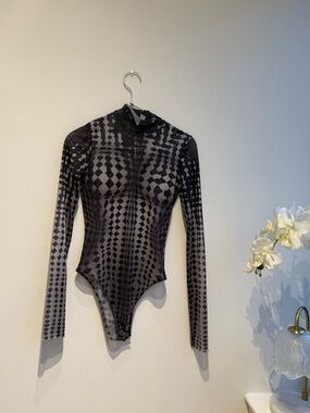 Sheer Mesh Bodysuit with an illusion woman’s figure design